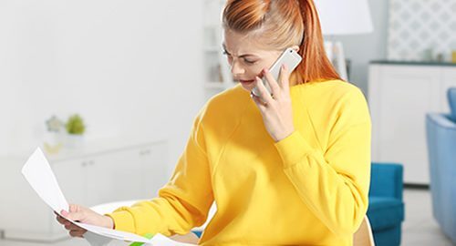 Credit card debt - Woman on the phone with customer service
