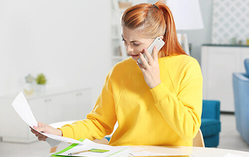 Credit card debt - Woman on the phone with customer service