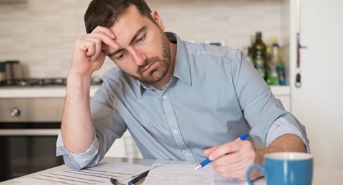 Man Stressed - Balance Transfer over Personal Loan for Debts