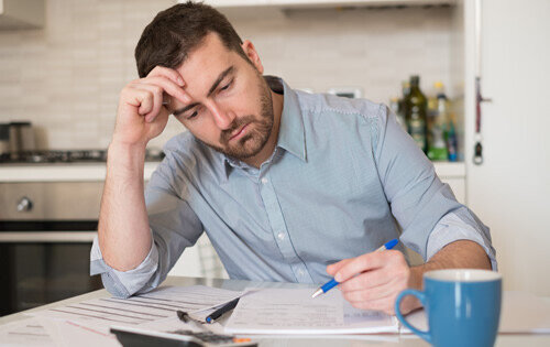 Man Stressed - Balance Transfer over Personal Loan for Debts