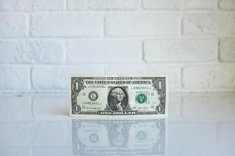 1 Dollar Bill on Shiny Table