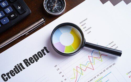 Magnifying glass on a credit report