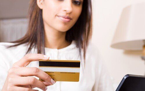 Woman holding a credit card
