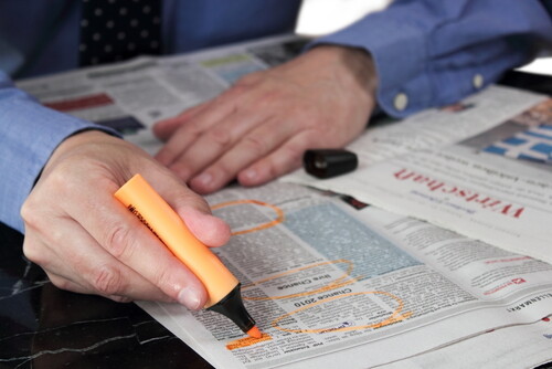 Circling newspaper ads
