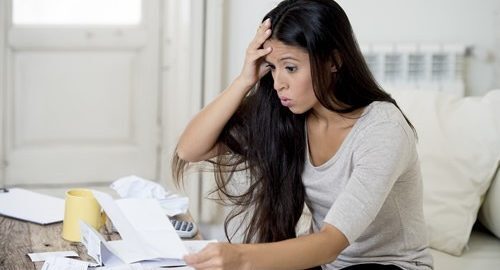 Stressed woman with credit card debt